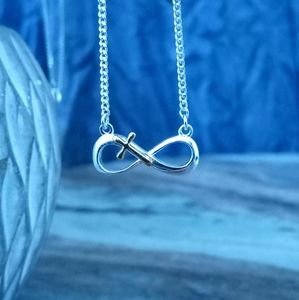 Silver infinity gold cross necklace